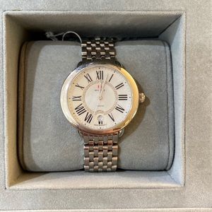 Michele watch with silver band and extra black band.